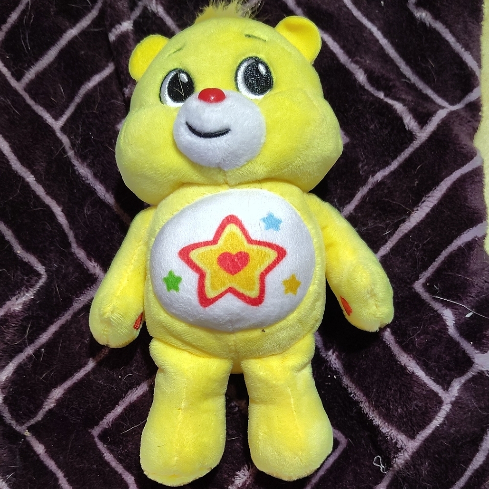 Yellow and Red Stuffed Animal Toy with Star Design